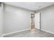 A bedroom featuring neutral walls and plank floors, offering a versatile and comfortable space at 118 S Yates Way, Denver, CO 80219