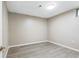 Bright bedroom with gray walls, a window, and plank floors, offering a versatile and comfortable space at 118 S Yates Way, Denver, CO 80219