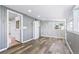 Bright, spacious bonus room with hardwood floors, painted paneling, and a neutral color palette at 118 S Yates Way, Denver, CO 80219