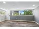 Cozy bonus room featuring hardwood flooring, and an oversized window at 118 S Yates Way, Denver, CO 80219