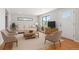 Well-lit living room boasts neutral tones, plush seating, and a cozy atmosphere at 118 S Yates Way, Denver, CO 80219