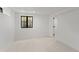 Basement bedroom with window and door to bathroom at 1655 S Marion, Denver, CO 80210