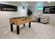 Finished basement recreation area with foosball table and seating at 1655 S Marion, Denver, CO 80210