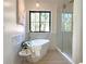 Luxurious bathroom with a freestanding tub and walk-in shower at 1655 S Marion, Denver, CO 80210