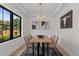 Elegant dining room with a wood table and large window at 1655 S Marion, Denver, CO 80210