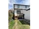 Back exterior of home with walkout deck and stairs to yard at 1655 S Marion, Denver, CO 80210