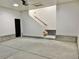 Bright two-car garage features interior stairs and access door at 1655 S Marion, Denver, CO 80210