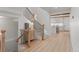 Light hallway with staircase, leading to an open kitchen at 1655 S Marion, Denver, CO 80210