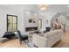 Bright living room featuring a modern fireplace and comfortable seating at 1655 S Marion, Denver, CO 80210