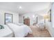 Spacious main bedroom with large bed, dresser, and sitting area at 3987 N Riviera Ct, Aurora, CO 80019