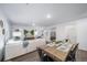 Open concept dining area with wooden table and chairs at 3987 N Riviera Ct, Aurora, CO 80019