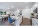 Modern kitchen features white cabinets and granite countertops at 3987 N Riviera Ct, Aurora, CO 80019