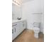Bathroom featuring a toilet, tile flooring and a vanity with matte black hardware at 12798 Ivy St, Thornton, CO 80602