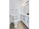 Bathroom with tile flooring, toilet and vanity featuring matte black hardware at 12798 Ivy St, Thornton, CO 80602