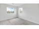 Bedroom with neutral carpet and two windows allowing for natural light at 12798 Ivy St, Thornton, CO 80602