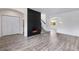 Bright living area with wood floors and a modern fireplace feature, perfect for entertaining or relaxing at 12798 Ivy St, Thornton, CO 80602