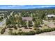 Expansive property showcasing a single-Gathering home amid lush greenery and distant mountain views at 19050 Archers Dr, Monument, CO 80132