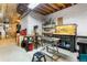 Unfinished basement featuring a workbench, tool racks, and a variety of tools at 19050 Archers Dr, Monument, CO 80132