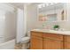 Cozy bathroom features a shower over tub and neutral vanity with mirrored cabinet at 19050 Archers Dr, Monument, CO 80132