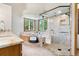 Bright bathroom featuring a soaking tub, a glass shower, and marble counters with a lovely view at 19050 Archers Dr, Monument, CO 80132