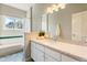 Bathroom featuring a large speckled counter, white cabinetry, and a combination shower and tub at 19050 Archers Dr, Monument, CO 80132