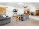 Finished living room featuring a fireplace, plush armchairs, and a mounted TV at 19050 Archers Dr, Monument, CO 80132