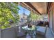 Relax on this covered balcony with a glass table perfect for enjoying outdoor meals at 937 N Clarkson St # 206, Denver, CO 80218