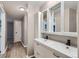 Bright bathroom with a double sink vanity, stylish mirrors, and updated fixtures, creating a modern look at 937 N Clarkson St # 206, Denver, CO 80218