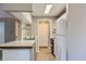 Functional kitchen with white cabinets, and laminate wood flooring, providing a bright and clean space at 937 N Clarkson St # 206, Denver, CO 80218