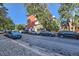 Street view of the building with ample parking in front of the property at 937 N Clarkson St # 206, Denver, CO 80218
