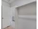 A well lit walk in closet with rods and shelving connects to an on suite bathroom at 286 Chardon Ave, Brighton, CO 80601