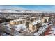 Winter aerial view of property with snow-capped mountains, buildings, and a well-maintained landscape at 3035 Oneal Pkwy # 36T, Boulder, CO 80301