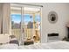 Bedroom with balcony access featuring mountain views, cozy seating, and elegant decor for a serene living space at 3035 Oneal Pkwy # 36T, Boulder, CO 80301
