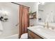 Bright bathroom featuring a tub/shower combo with decorative curtain and modern vanity at 3035 Oneal Pkwy # 36T, Boulder, CO 80301