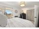 Bedroom with light walls, carpet, a queen bed, and sliding glass doors to the outside deck at 3035 Oneal Pkwy # 36T, Boulder, CO 80301