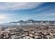Breathtaking winter aerial view of the city skyline with snow-covered mountains in the background at 3035 Oneal Pkwy # 36T, Boulder, CO 80301