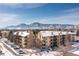 Exterior view of building featuring snow-covered grounds, snow-capped mountains and blue skies at 3035 Oneal Pkwy # 36T, Boulder, CO 80301