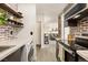 Kitchen features brick walls, marble countertops, and modern appliances, including a washer/dryer at 3035 Oneal Pkwy # 36T, Boulder, CO 80301