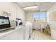 Community laundry room featuring multiple white washing machines and a utility sink at 3035 Oneal Pkwy # 36T, Boulder, CO 80301