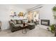 Relaxing living room has neutral carpet, contemporary decor, and sliding glass doors leading to the outdoor balcony at 3035 Oneal Pkwy # 36T, Boulder, CO 80301