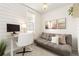 Bright office space featuring shiplap walls, neutral tones, and a comfortable gray sofa at 3035 Oneal Pkwy # 36T, Boulder, CO 80301