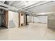 Unfinished basement with exposed beams, electrical panel, and concrete floor at 22435 E 7Th Pl, Aurora, CO 80018