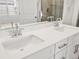 Bathroom featuring double sink vanity with white cabinets and chrome faucets at 22435 E 7Th Pl, Aurora, CO 80018