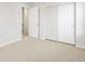 Bright bedroom featuring soft carpet, white walls, and closet space creates a peaceful atmosphere at 22435 E 7Th Pl, Aurora, CO 80018