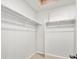 Walk-in closet with shelving racks and neutral carpeting at 22435 E 7Th Pl, Aurora, CO 80018