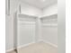 Walk-in closet with shelving racks and neutral carpeting at 22435 E 7Th Pl, Aurora, CO 80018