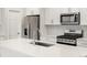 Beautiful kitchen with stainless steel appliances, white cabinets, and stylish backsplash at 22435 E 7Th Pl, Aurora, CO 80018