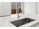 Bright kitchen with stainless steel sink and faucet, overlooking the backyard at 22435 E 7Th Pl, Aurora, CO 80018