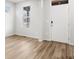 Bright living room boasting natural light, wood-look floors, and neutral paint, creating an inviting space at 22435 E 7Th Pl, Aurora, CO 80018