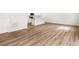 Open living space featuring a kitchen island, and wood-look floors, offering versatile options for modern living at 22435 E 7Th Pl, Aurora, CO 80018